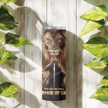 Load image into Gallery viewer, Lifestyle photo of Armor of God™ tumbler placed in a warm-toned setting.
