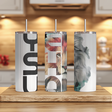 Load image into Gallery viewer, Lifestyle photo of Yeshua™ Lion of Judah tumbler displayed on a rustic table with cozy background setting.
