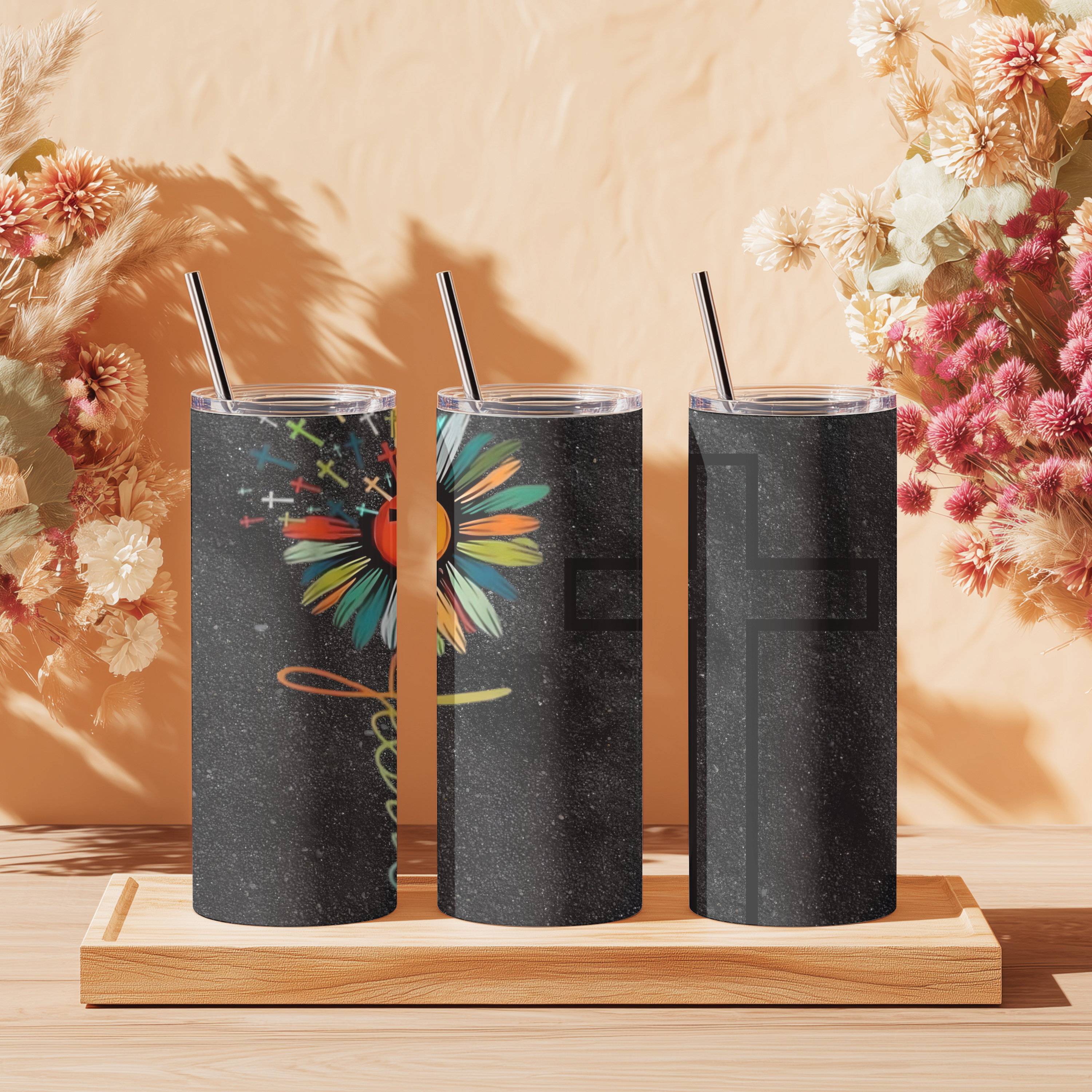 Close-up detail of Bloom in Faith™ tumbler highlighting cross-centered flower design and “Jesus” lettering down the stem.
