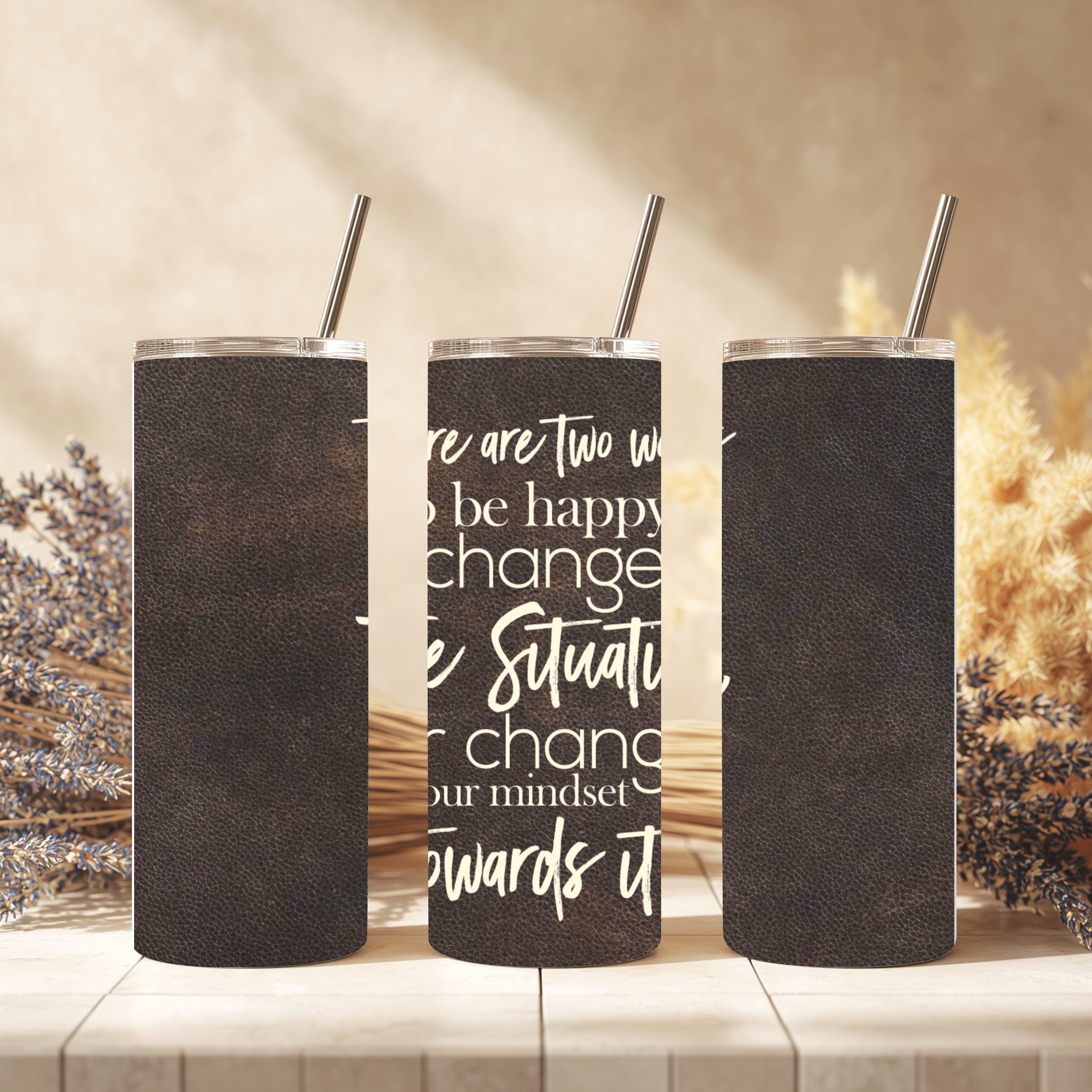 Close-up view of tumbler showing affirmation text: “There are two ways to be happy: change the situation, or change your mindset towards it.”