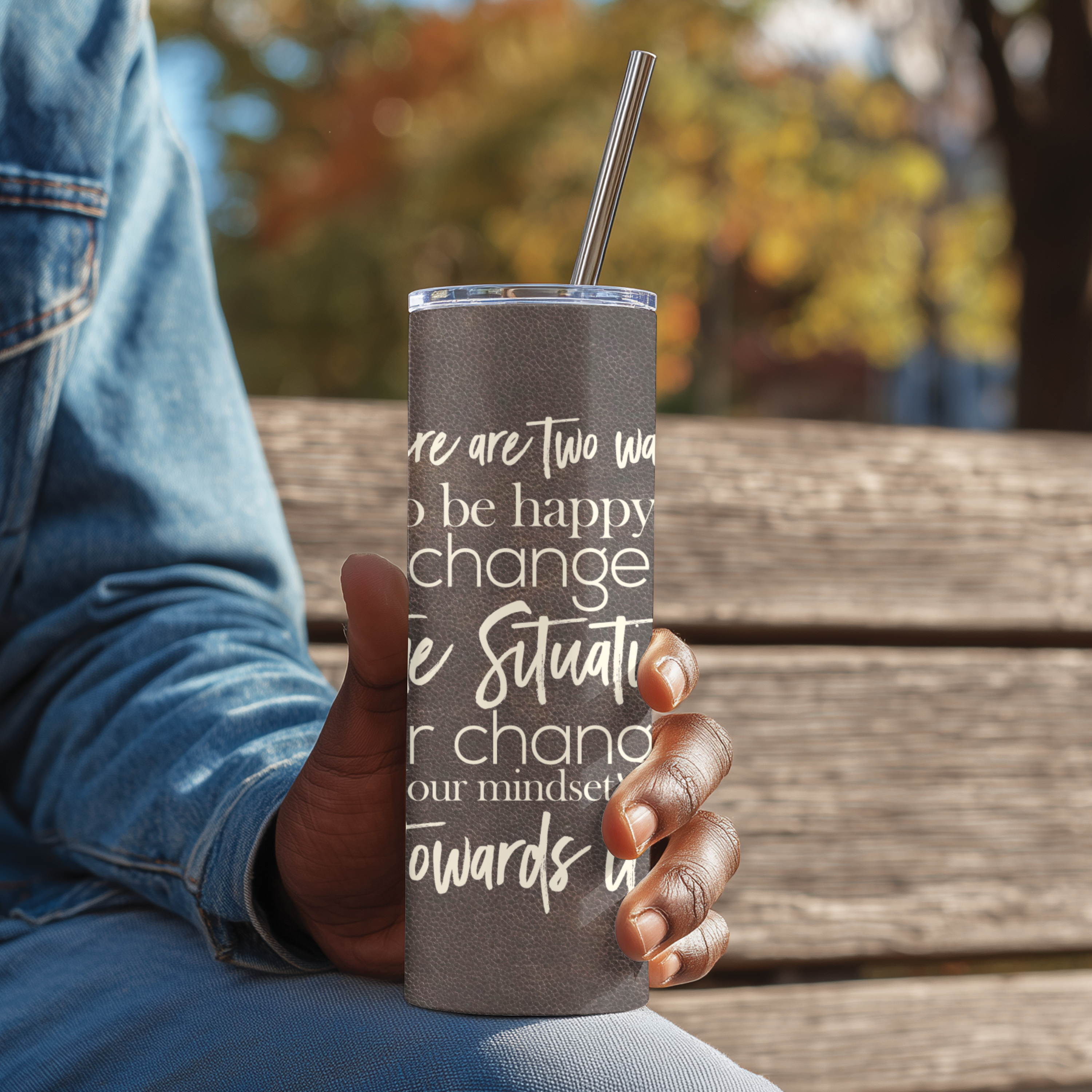 Side angle of Change the Situation™ tumbler featuring motivational quote design.