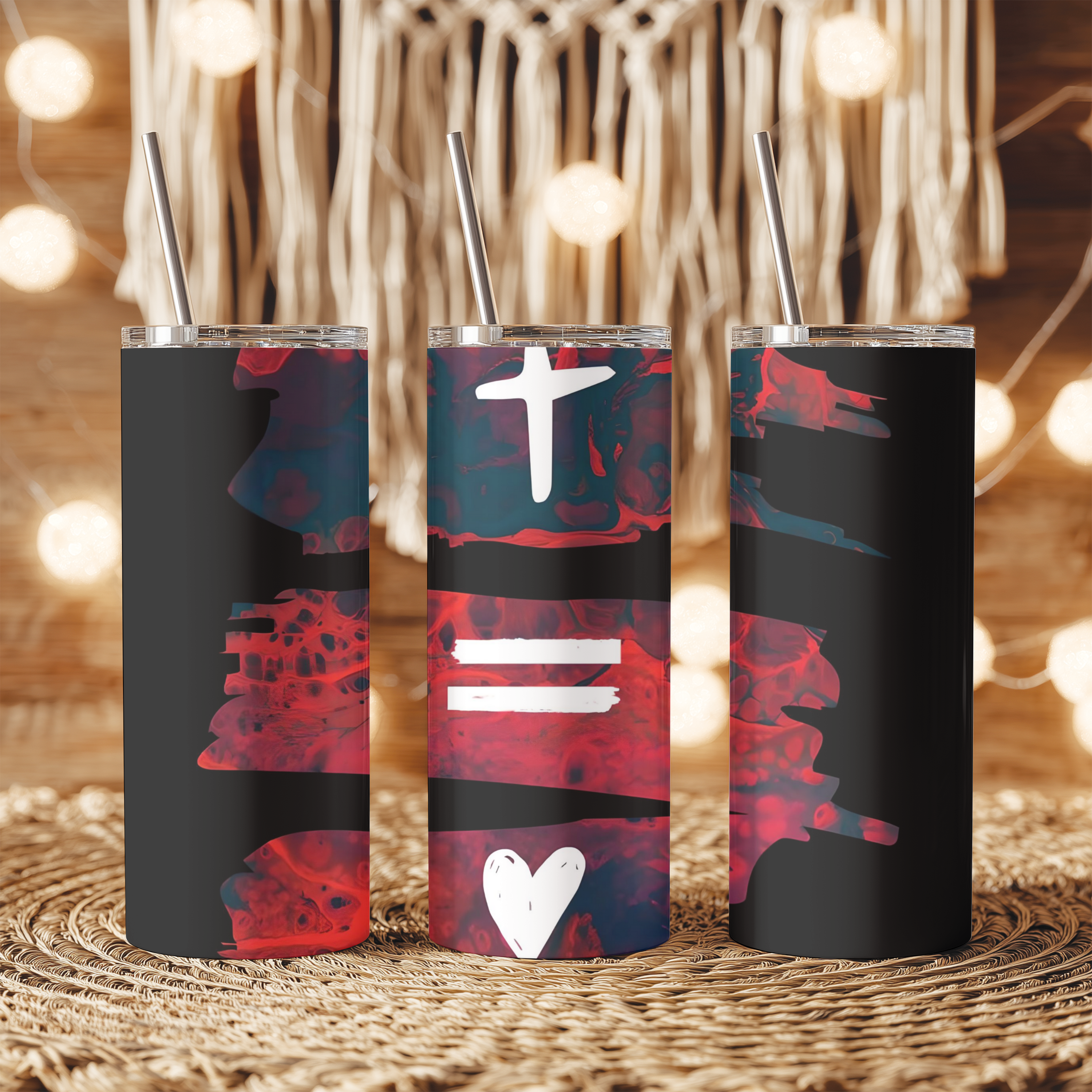 Lifestyle photo of the Cross Equals Love™ tumbler placed on a table, showing modern Christian design.