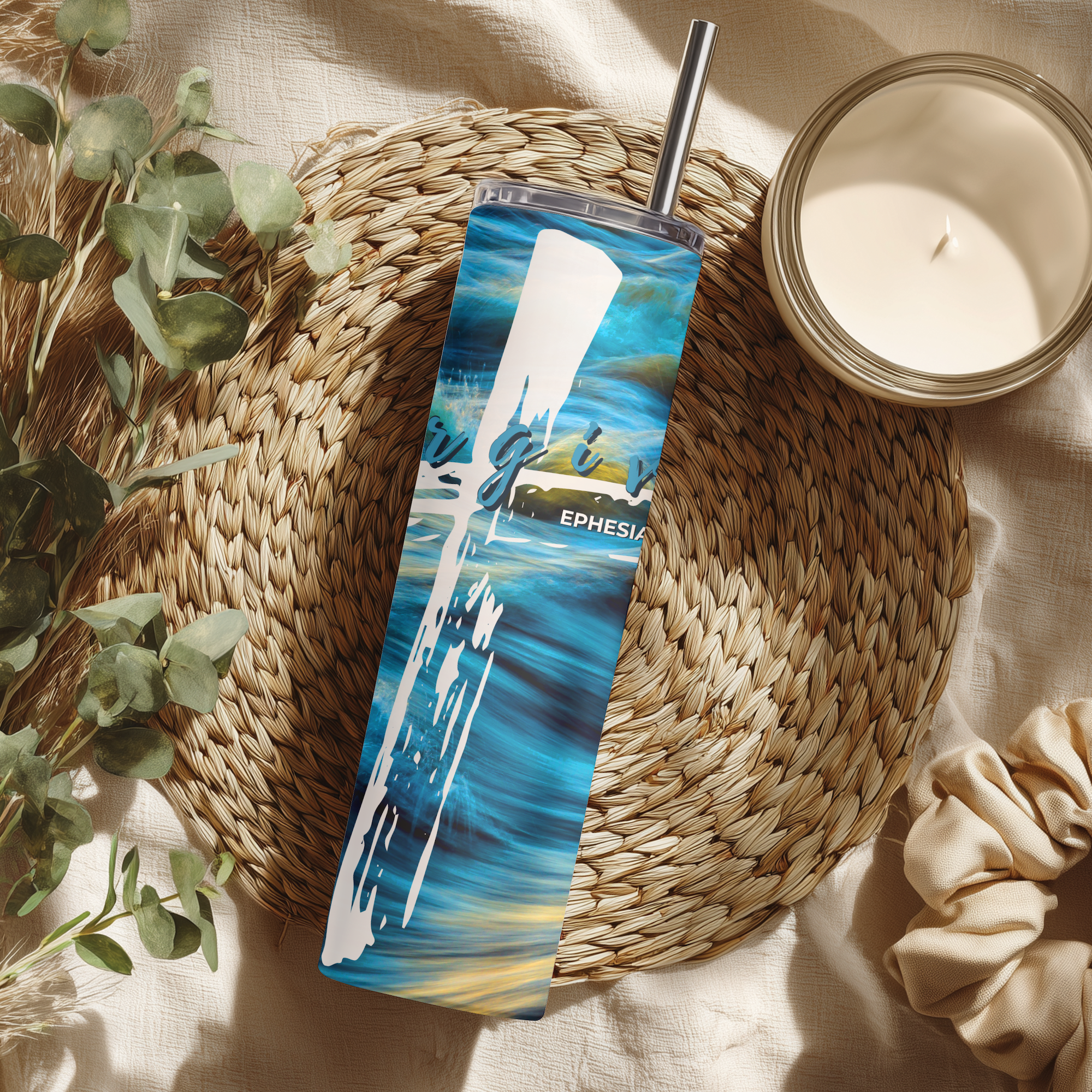 Lifestyle photo of forgiven scripture tumbler with candle and home decor, inspirational Christian gift cup