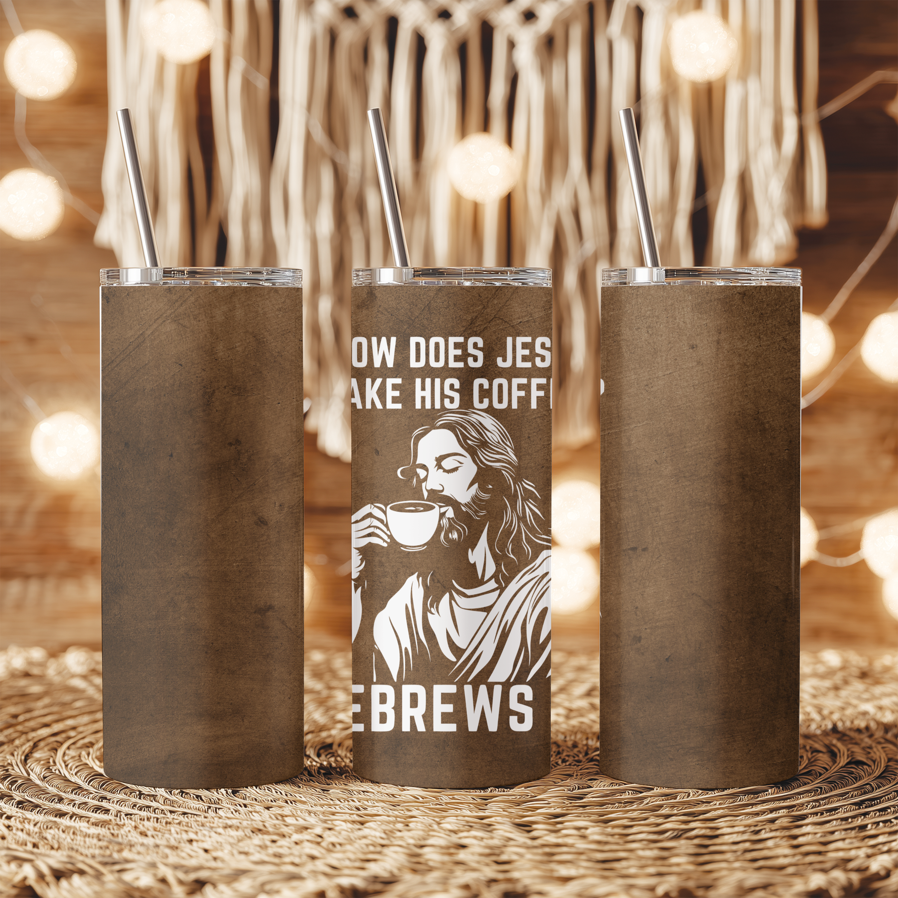 He Brews It™ tumbler displayed on tabletop, insulated stainless steel cup with playful scripture-inspired humor.