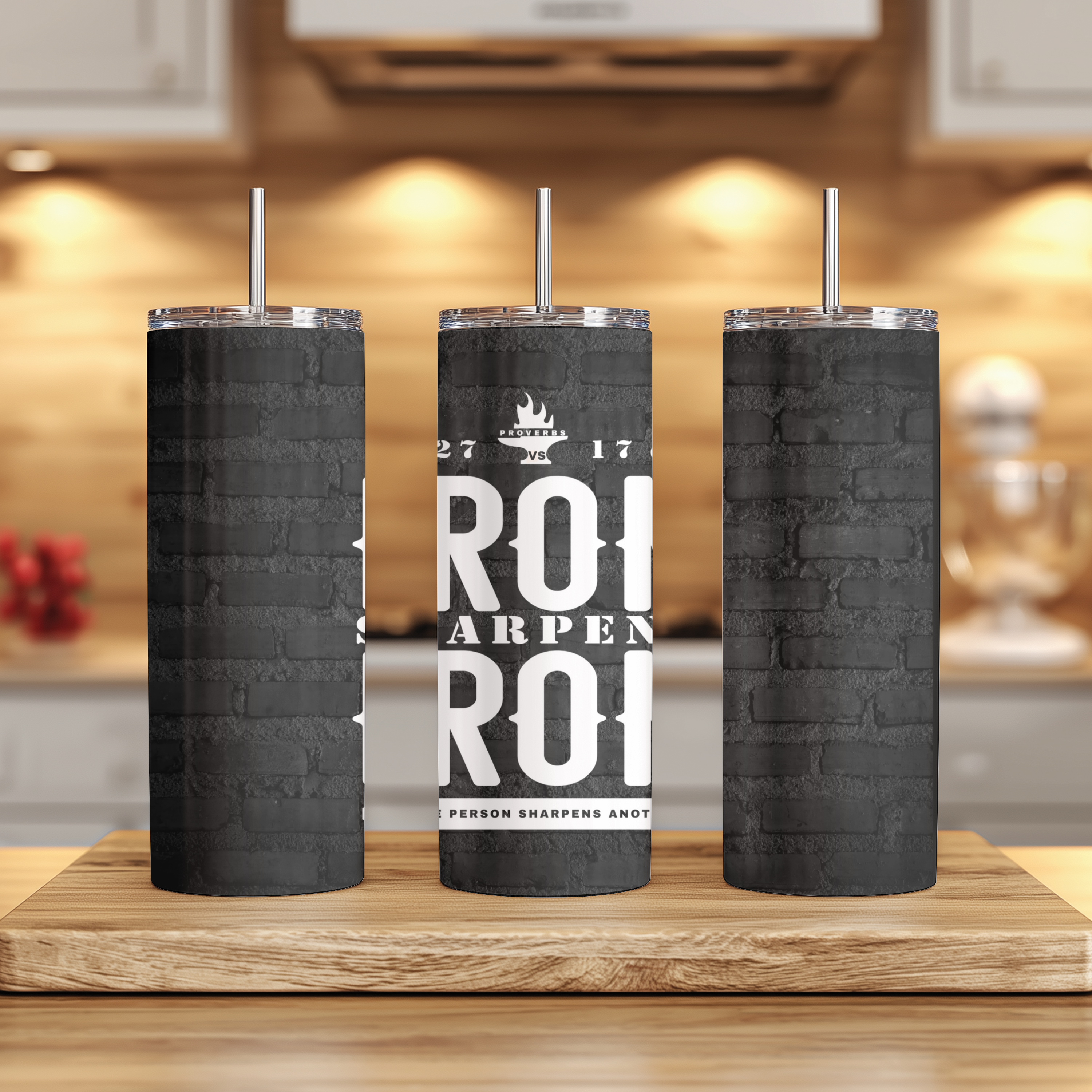 Iron Sharpens Iron™ tumbler displayed on table, stainless steel design symbolizing brotherhood and accountability.