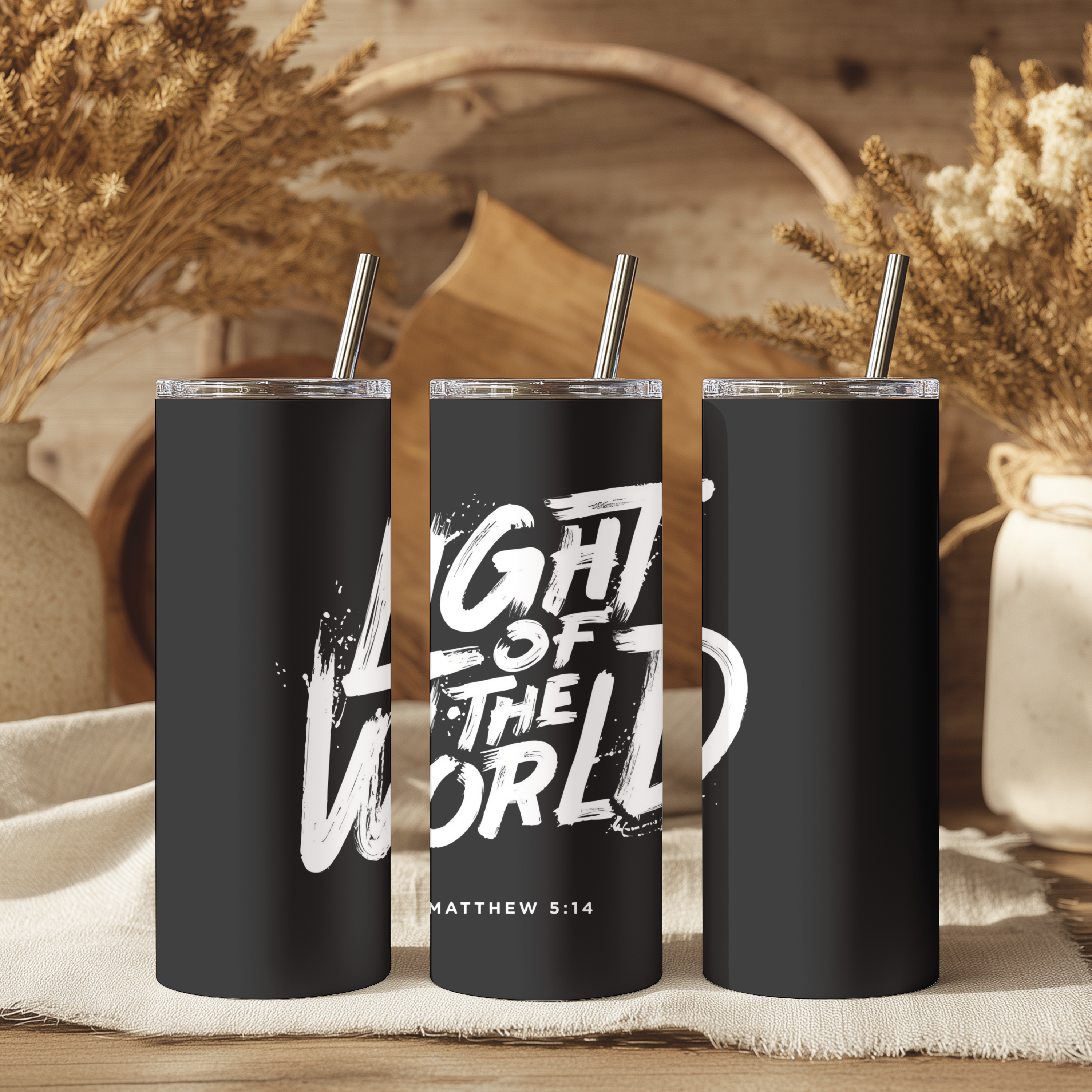 Close-up view of Light of the World™ tumbler highlighting detailed typography and matte finish.