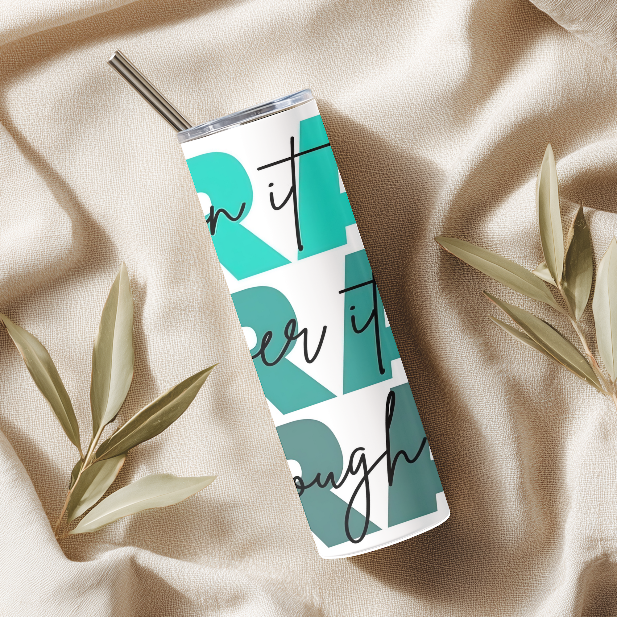Lifestyle photo of Pray On It, Over It, Through It™ tumbler styled on a wooden surface with warm background setting.