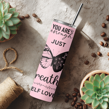 Load image into Gallery viewer, Lifestyle photo of Shine Bright™ tumbler in a cozy setting.
