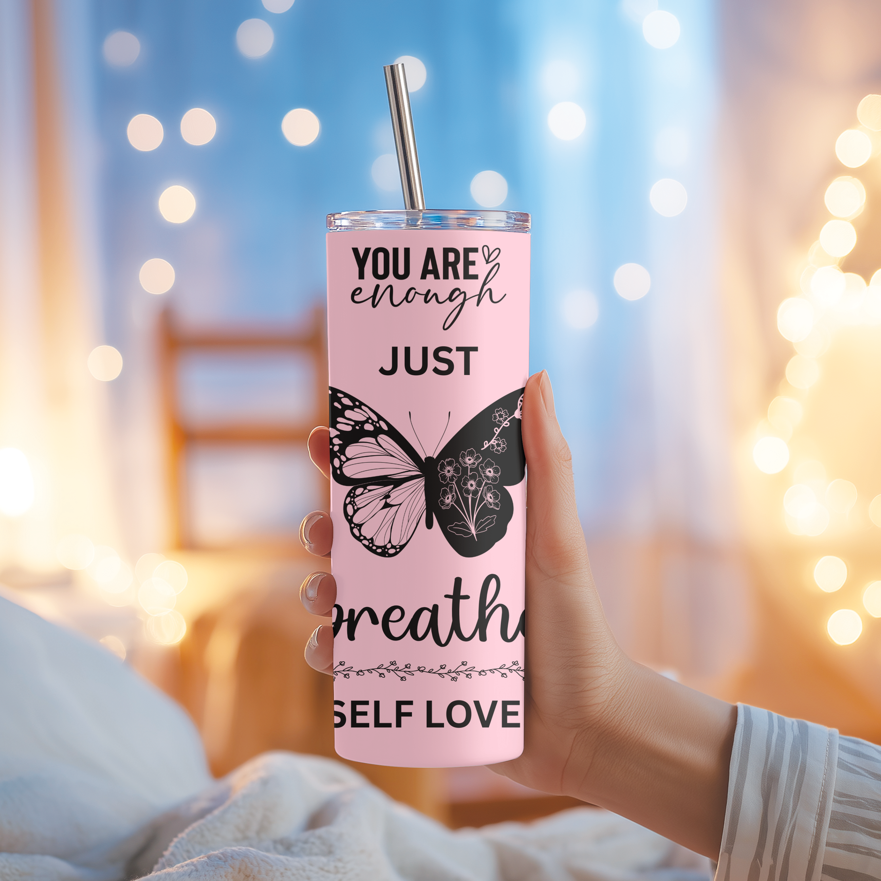 Side angle of Shine Bright tumbler with pink affirmation design.
